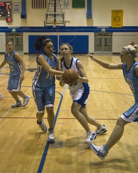 Falcon Cayla Calderwood takes to the air against Sultan point guard Marissa Donnelly Tuesday during South Whidbeys 63-39 loss.