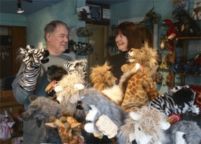 Richard and Tess Guenther take a little time out to play with the stars of their shop. Act II Books and Puppets has moved from First Street to 111 Anthes Ave.