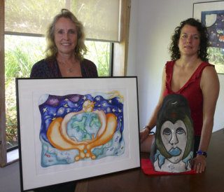 Emily Day and Katherine Trenshaw show off some of Trenshaw’s work that will be shown during her exhibit that runs Aug. 19 through Aug. 26 in Bayview. The art is for sale at Creative Moves in Langley.