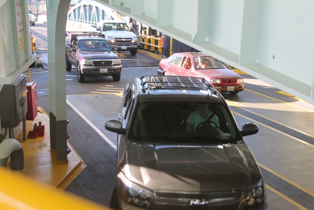 Washington State Ferry travelers board the new Tokitae