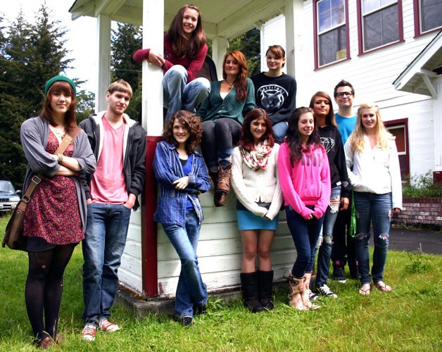 Students of Bayview School’s graduating class of 2012 assemble around the historic bell in front of the alternative high school. In front are Sydney Mann