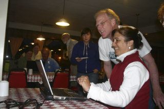 Helen Price Johnson reacts after seeing the first vote tally that puts her in the lead for the District 1 Island County commissioner race Tuesday night.