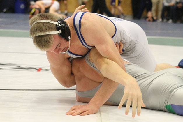 South Whidbey High School junior Hunter Newman attempts to pin Liberty’s Joseph Jarman in the 145-pound bracket of the Everett Classic on Jan. 2 at Everett High School. Newman’s weight class was stacked with four state-ranked wrestlers. Newman tied for fifth at the tournament.