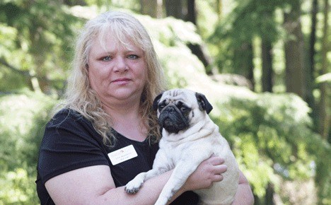 Ann Donavon and her pet pug Bubbles at Donovan's daughter's house in Greenbank on Thursday: 'I'm just trying to keep a good attitude.'