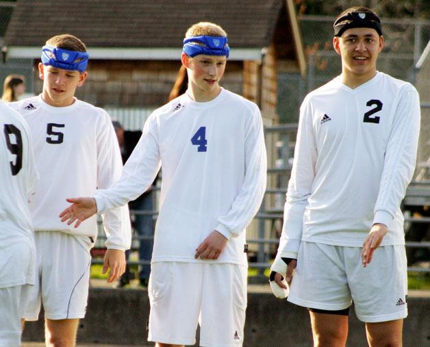 Padded head protection like these worn by Falcon boys soccer players Cameron Coupe