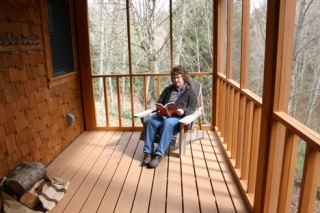 Owner Petra Martin indulges herself with some quiet time on the porch of the refuge.