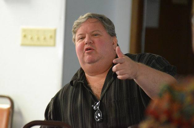 Bill Burnett speaks at a recent meeting in Oak Harbor about a levy proposal. Burnett filed suit against Island County over Commissioner Kelly Emerson’s removal as chairwoman of the board and the appointment of Commissioner Jill Johnson to the position.