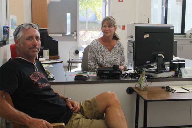 Charlie Davies (left) and Christine Admundson (right) have been busy settling in to South Whidbey Academy’s new home in the north wing of South Whidbey High School.