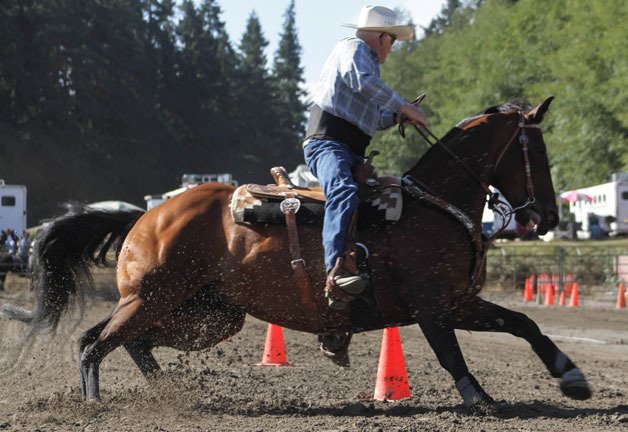 Boyd Pepper turns during the keg event at the Whidbey O-Mok-See at the Island County Fairgrounds on Aug. 24.