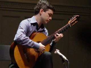 Sean Vaughn Owen is a classical guitarist and musical scholar who will return to his native Whidbey for a performance on Saturday