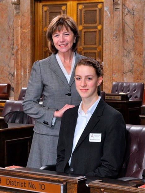 Rep. Norma Smith takes a moment for a photo with student page Annalies Schuster on the floor of the Washington State House of Representatives in Olympia.