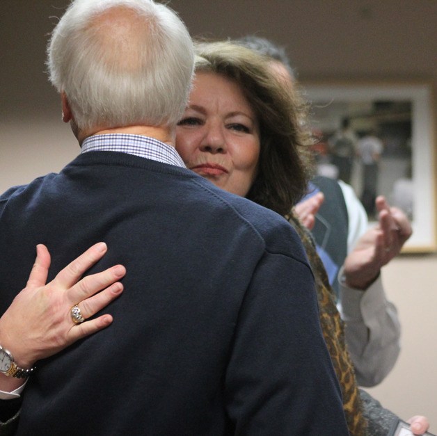 Nancy Rowan hugs former mayor Fred McCarthy during the Jan. 4 Langley City Council meeting. She was given a mayor’s excellence award for her service with the Langley Chamber of Commerce. She stepped down as president in late 2014.