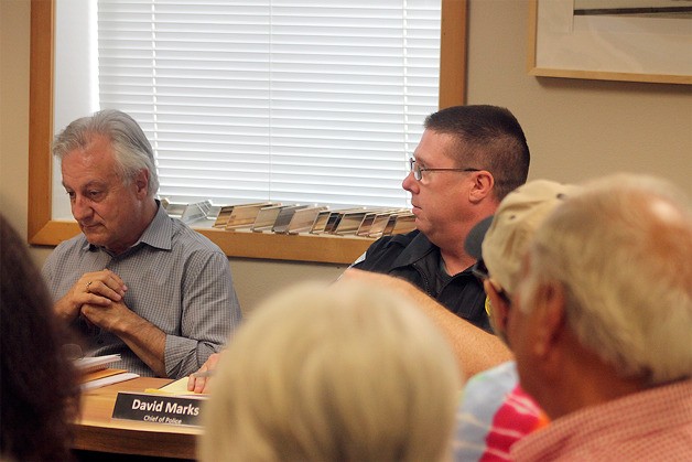 Langley Police Chief Dave Marks (right) addresses the city council Monday concerning noise at Mo’s Pub.