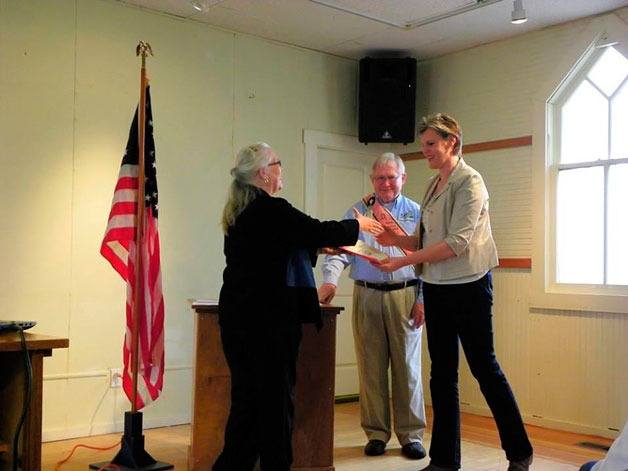 Deer Lagoon Grange Master Tarey Kay presented Detective Sgt. Laura Price of the Island County Sheriff’s Office with her award for Citizen of the Year. Price was given the honor for her service to South Whidbey.