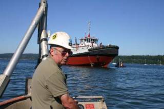 Yard foreman and launch supervisor Ken Gillette checks conditions as he awaits high tide.