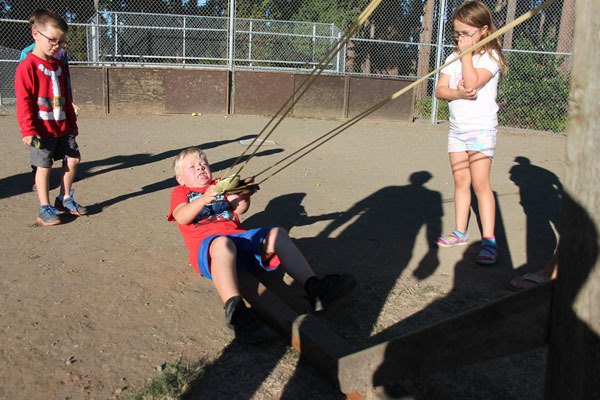 Clinton kids launch projectiles from a trebuchet during the first Clinton Community Picnic in 2014.