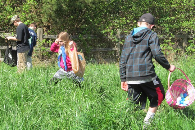 Children search for Easter eggs during the Easter Egg Hunt at Bayview  Hall on Saturday