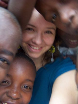 Megan Sarver of Clinton with children at the Tanzanian orphanage where she volunteered this past summer.