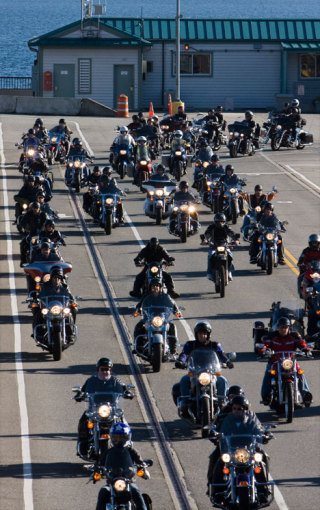 Bikers leave the Clinton ferry on their way to Anacortes on Sunday for the annual Oyster Run.