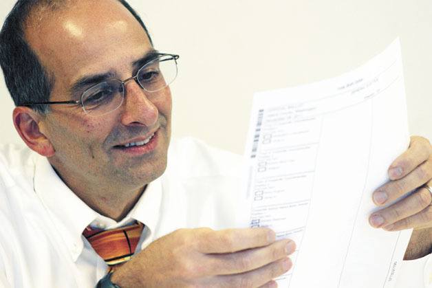 Prosecuting Attorney Greg Banks laughs as he tries to decipher a questionable vote on Wednesday.