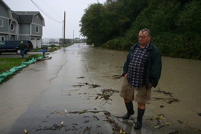 A man surveys flooding in Scatchet Head.