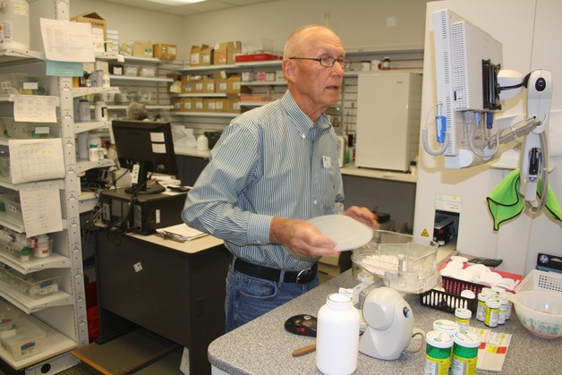 A pharmacist at Linds Pharmacy in Coupeville fulfills a prescription order. The pharmacy was sold to Rite-Aid and closed.