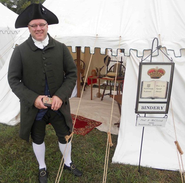 Whidbey artist Paul McClintock demonstrates his skill as an 18th century bookbinder at a living history event in Virginia.