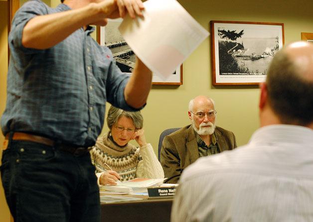 Langley City Councilwoman Rene Neff and Councilman Hal Seligson listen to Island County Hydrologist Doug Kelly