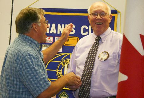New Kiwanis president Don LaMontagne receives congratulations from past president Jim Henderson.