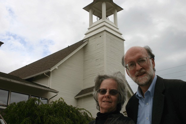 Rev. David Vergin and his wife Mary outside Langley United Methodist Church. Sunday’s service will be their last before retirement.