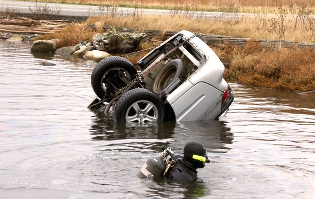 A diver had to swim 35 to 45 feet down into a pond Monday morning to find a submerged car.