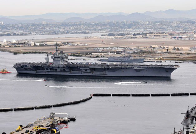 The aircraft carrier USS Nimitz departs Naval Air Station North Island for scheduled maintenance at Puget Sound Naval Shipyard and Intermediate Maintenance Facility in Bremerton.