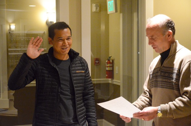 Jack Ng is sworn in as the new Port of South Whidbey district 1 commissioner by board Chairman Curt Gordon. Ng replaces Dennis Gregoire