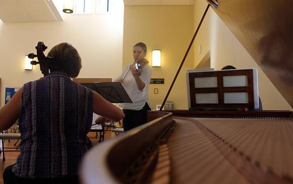Tekla Cunningham (right) practices the Whidbey Island Music Festival’s first weekend musical program with cellist Meg Brennand (left) and harpsichordist Henry Lebedinsky (not pictured). Cunningham is the director of the festival and will play the baroque violin in all four programs in the festival.