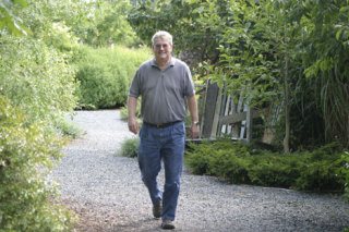 Jim Tompkins stretches his legs at Bayview Corner. Tompkins joins 400 others this weekend for the Whidbey Walking Festival in Coupeville.