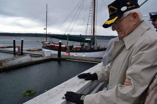 Pearl Harbor survivor Cecil Calavan bows his head in prayer following a wreath-laying to commemorate the 71st anniversary of the attack on Pearl Harbor.