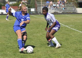 South Whidbey's Stephanie Raymond battled Friday Harbor's Whitney Porter on Saturday during the Falcon's 7-0 victory