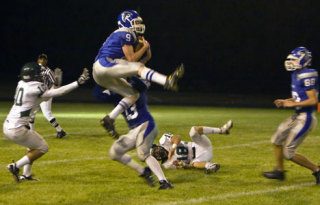 South Whidbey defensive back Lucas Yale jumps high for his second interception of the night against Mount Vernon