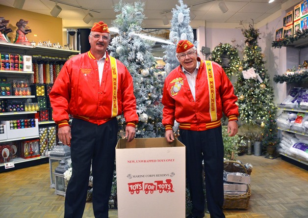 Coordinator Bob Gabelein and assistant coordinator Ed Donery pose with a Toys for Tots bin at the Freeland Ace store.