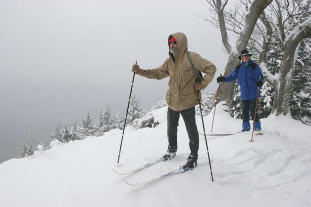 Dana and Dave Morphew admire an approaching storm cloud as they look out over Puget Sound from a bluff at Scatchet Head on Wednesday. Clinton received more than a foot of snow during this week’s wintery blast.