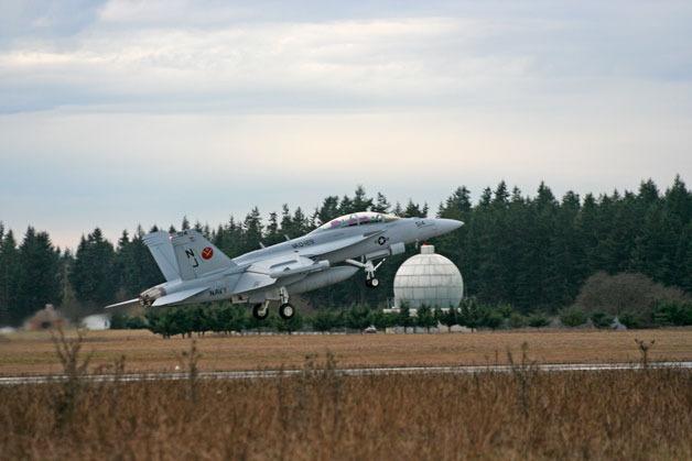 An EA-18G Growler jet takes off at Naval Air Station Whidbey Island’s Outlying Field Coupeville on Central Whidbey. The base is slated to receive more than $117 million for jet programs.