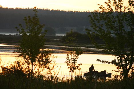 A man puts in a boat at Deer Lagoon on Friday morning. County commissioners will hold a public hearing later this month to consider new restrictions on shooting at the popular destination for waterfowl hunting.