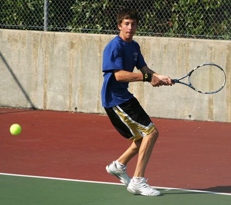 Falcon Van Morgen returns a serve at a recent tennis match.