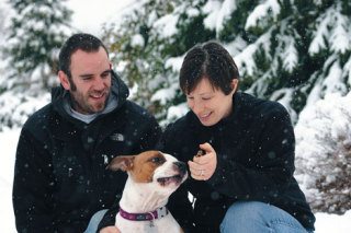 Ben Morgan watches as Erin Morgan tempts their dog Shimmy with a treat during a break in shopping for Christmas trees at Bayview Farm & Garden on Sunday.