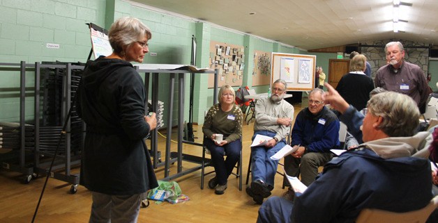 Sherryl Christie leads a small group during a Clinton Community Council meeting Thursday night with the Island County planning department. Several ideas included ways to attract and keep people in the commercial hub along the highway.