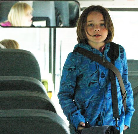 Fifth-grader Isabelle Grimm boards the No. 31 bus Wednesday to get ready for the trip home after a long day at elementary school.