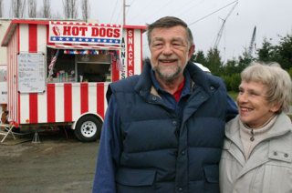 John and Ann Kirkham stand in front of their “Snack Shack” hot dog stand along Cameron Road in Freeland.