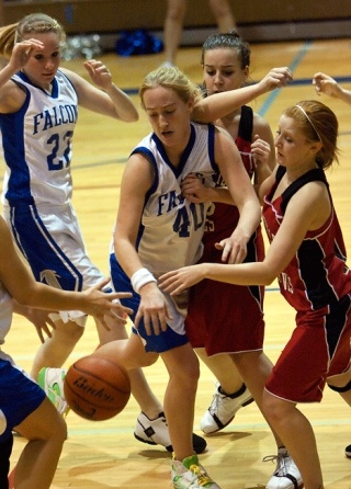 Falcon forward Lindsey Newman finds a bit of trouble in traffic against a Coupeville defender Saturday during South Whidbey’s 60-37 win over the Wolves.