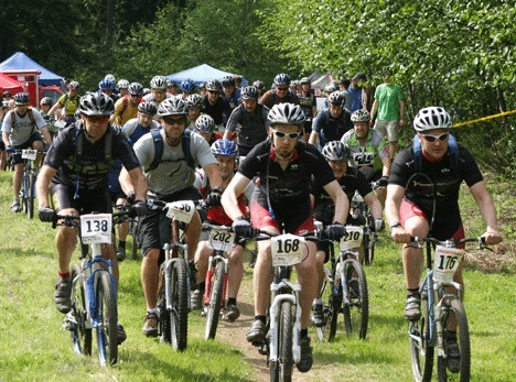Mountain bike riders take off for their grueling 5.6-mile bike ride through the woods of Langley in last year's Whidbey Island Mudder.