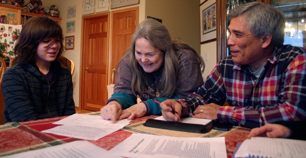 Evan Ray receives some college planning help from Marcia and Clyde Monma during a recent visit at their Cultus Bay home.